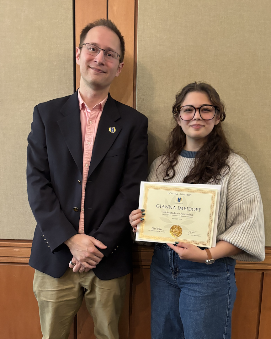 IURC recognition photo with professor and certificate